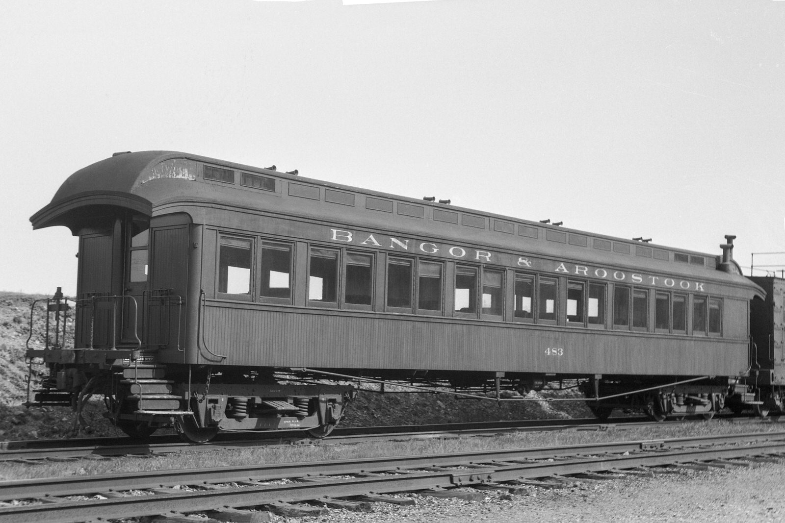 Bangor & Aroostook wooden coach #483 at Oakfield, Maine on May 15, 1951.