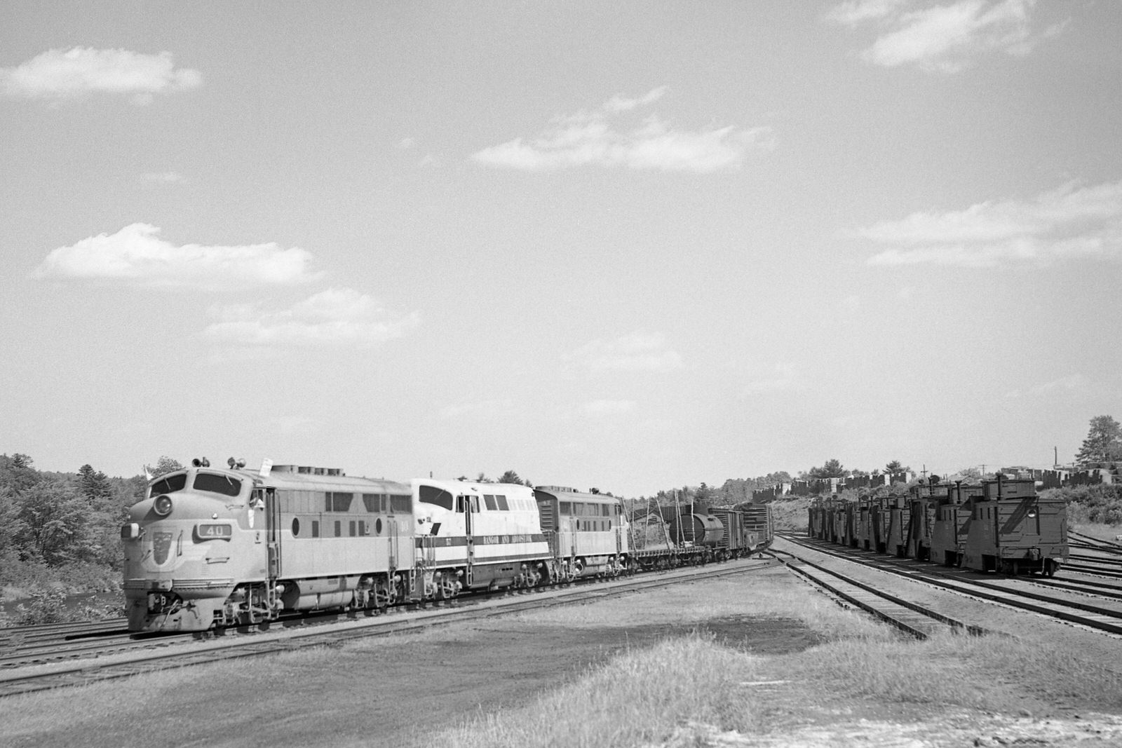 BAR 40, 57, 42 north on train #55 @ Brownville, ME on 7/17/1953.