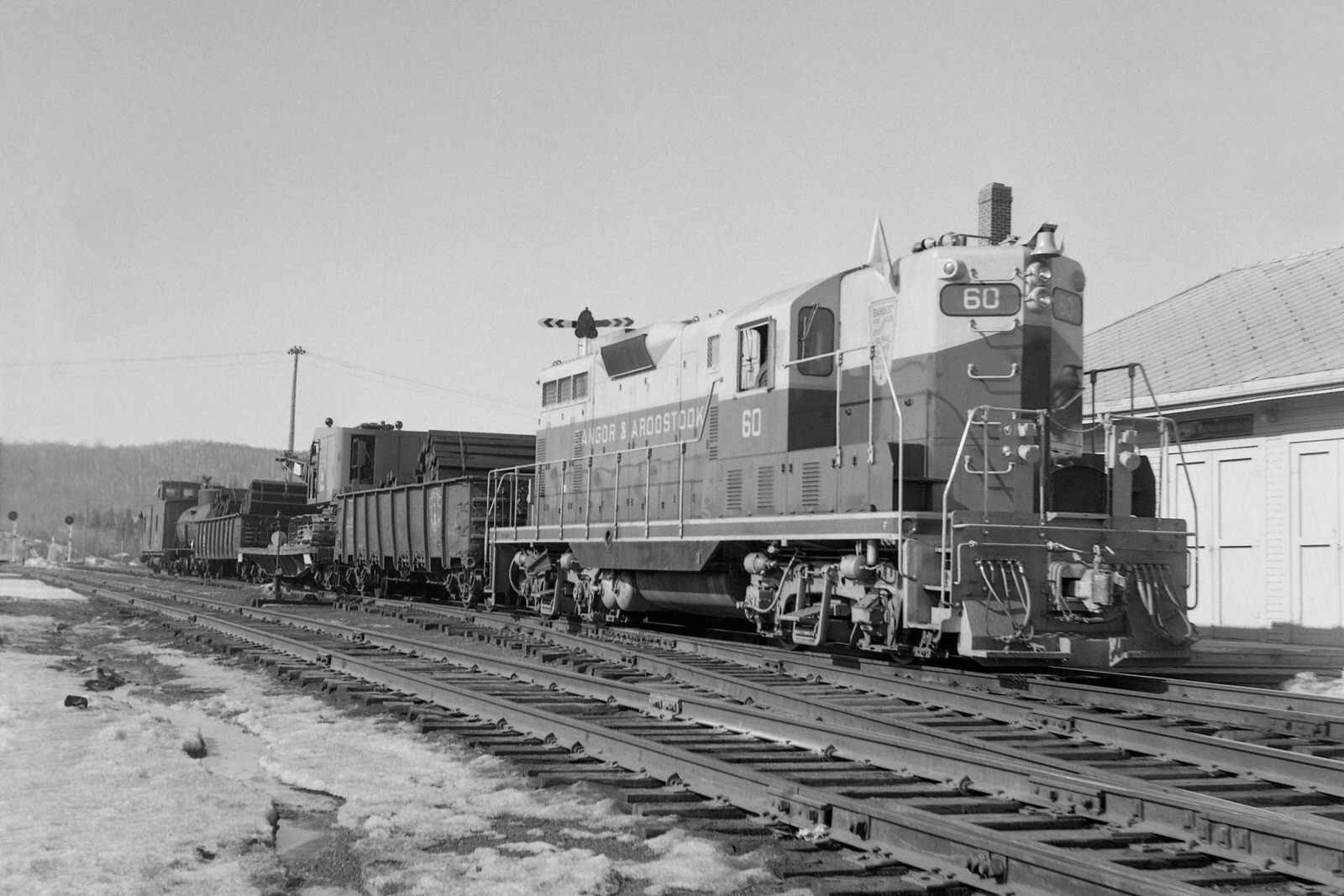 BAR GP7 #60 with a work train at Millinocket, ME on 3/31/1959.