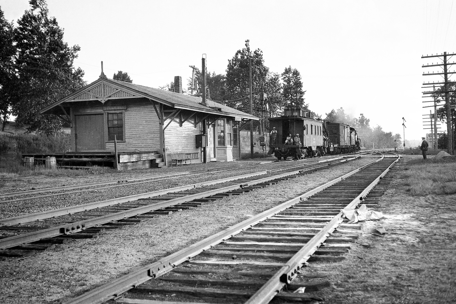 Boston & Maine Railroad depot at Still River, MA. Date & Photographer are unknown. The train in the photo with the three crew members sitting on the back of the buggy are headed towards Worcester, MA.