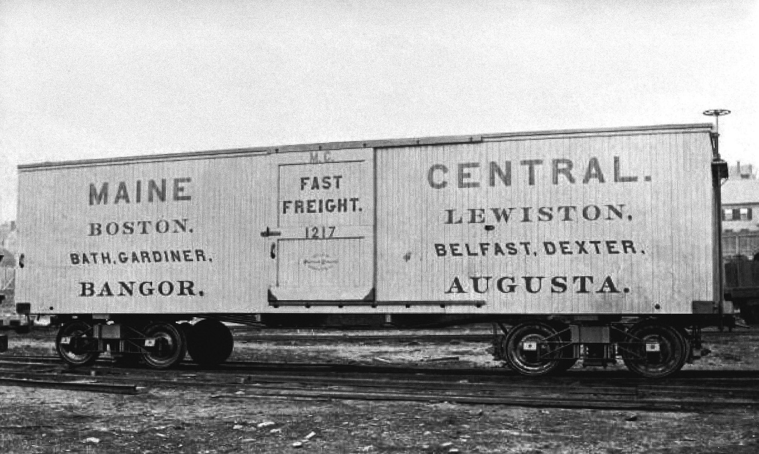 Maine Central Railroad wooden boxcar #1217. This image is grainey but the image is rare. This photo will print with a white border along the top and bottom. (8x10)