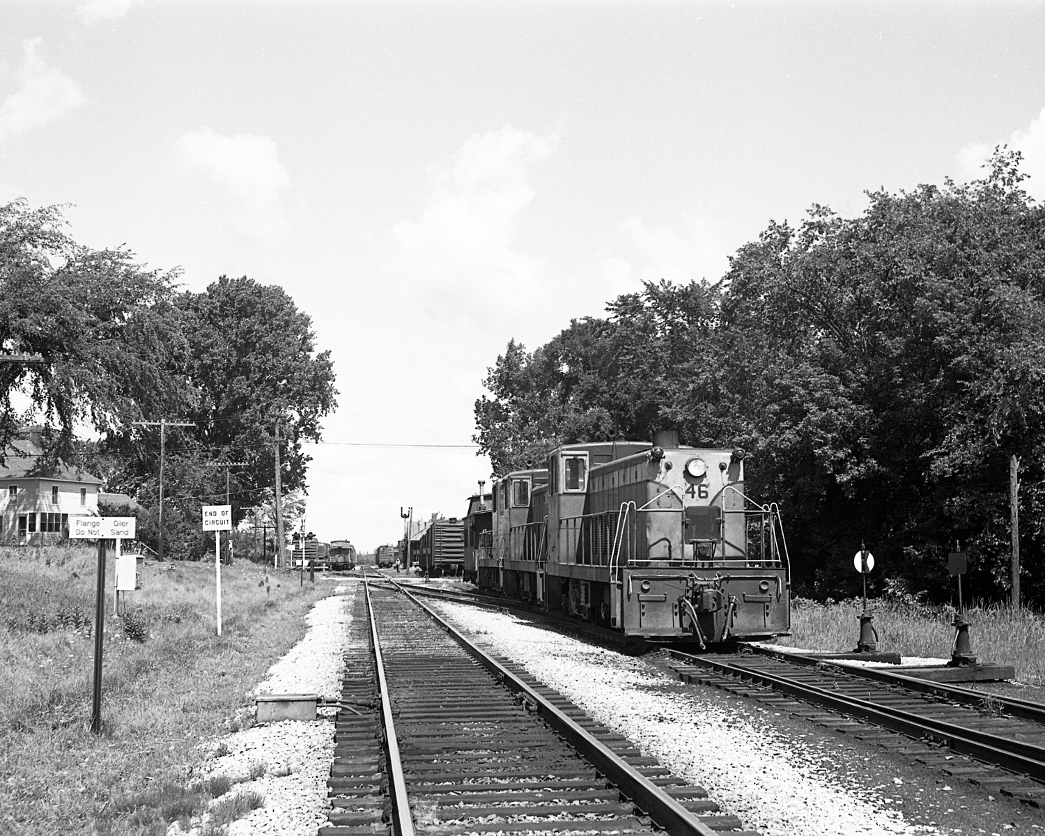 St. Johnsbury & Lamoille County Railroad 70 tonners #46, 54 & Montpelier & Barre #19 switching  at StJ&LC's yard in Swanton, VT. Mid to late 1960's. (8x10)