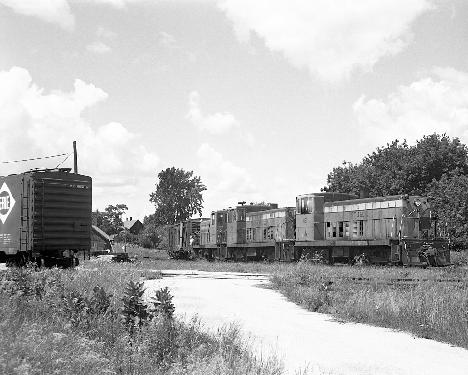 St. Johnsbury & Lamoille County Railroad 70 tonners #46, 54 & Montpelier & Barre #19 on train #74 switching Swanton, VT yard during the mid to late 60's. (8x10)